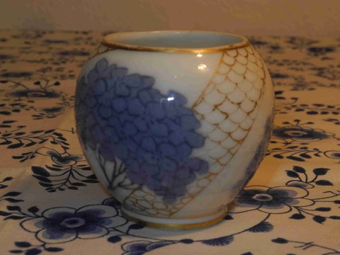 Hydrangea with golden net vase