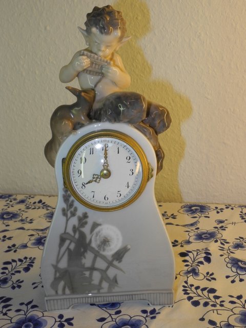 Faun clock with squirrel
