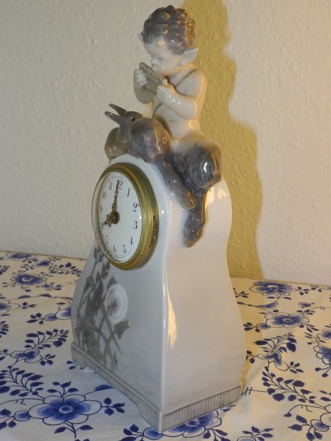 Faun clock with squirrel