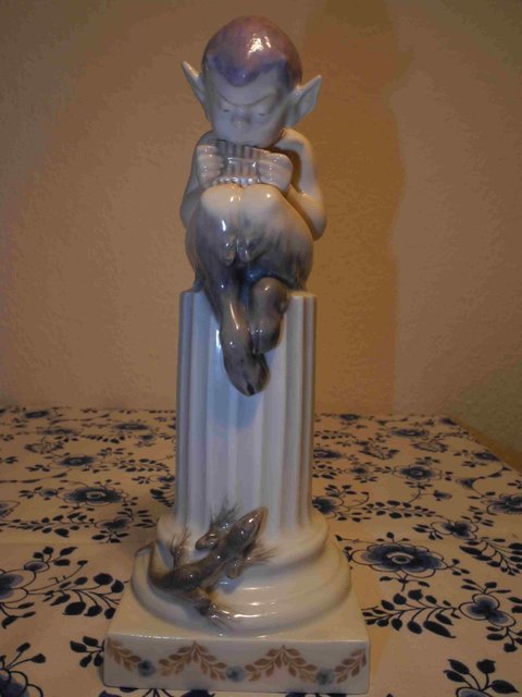 Faun on column with lizzard